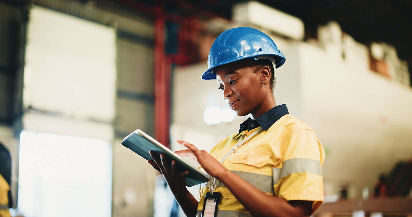 A government contractor working in a manufacturing facility